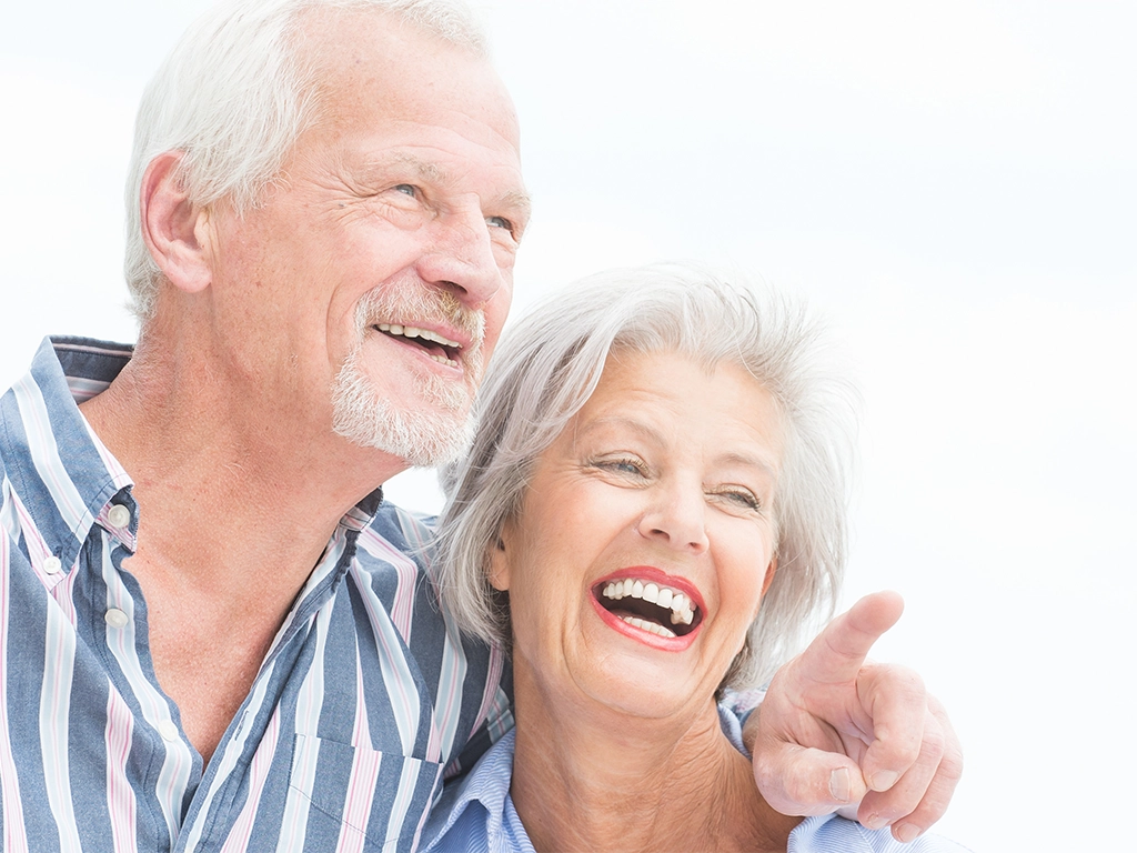 happy senior couple laughing and smiling